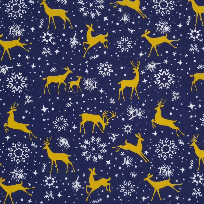 Prancing christmas reindeer with pretty stars and snowflakes are printed on a navy polycotton fabric
