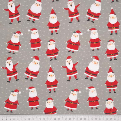 A smiley Santa is surrounded by cute love hearts and are printed on a silver polycotton fabric with a cm ruler at the bottom