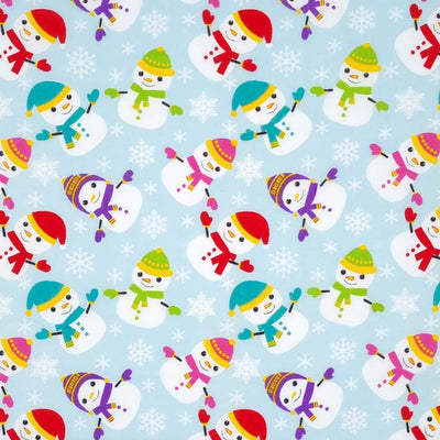 Happy scattered snowmen and snowflakes are printed on a light blue polycotton fabric.