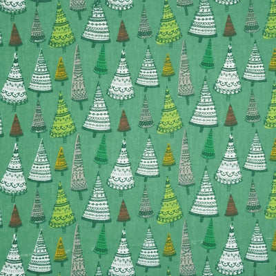 Intricate hand-drawn Christmas trees are printed on a forest green polycotton fabric.
