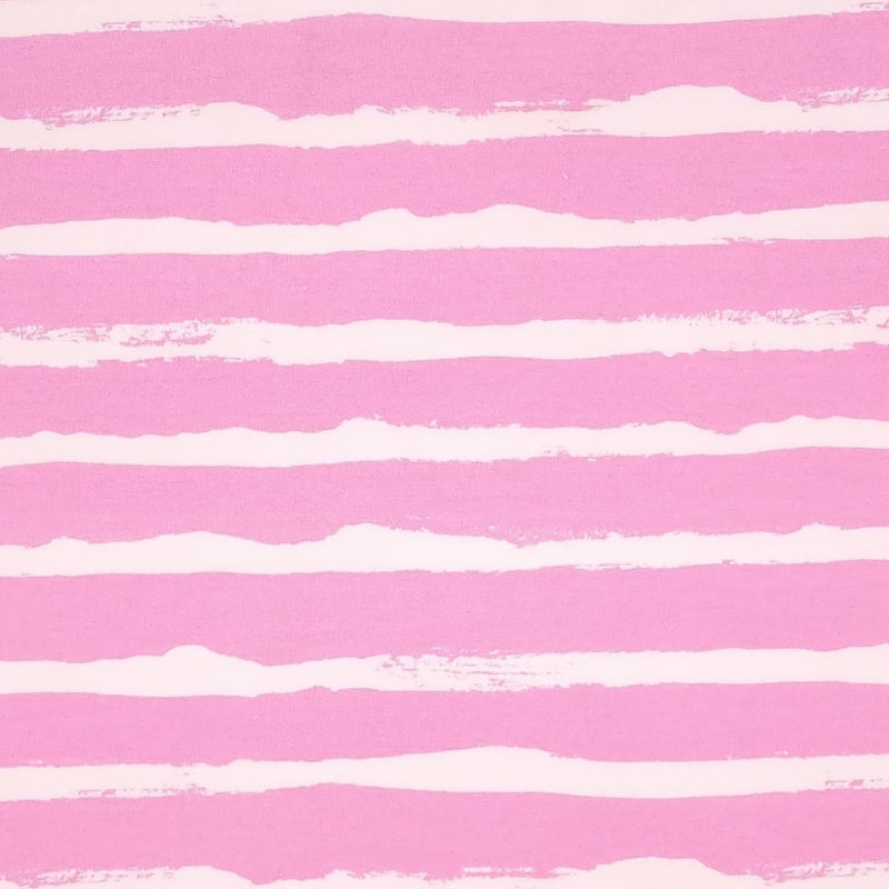 White painted stripes printed on a pink french terry fabric