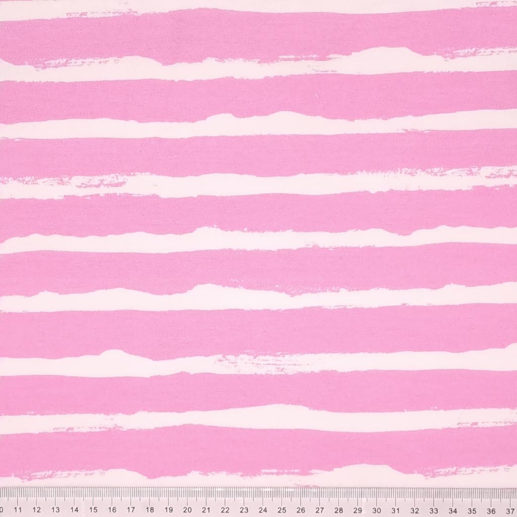 White painted stripes printed on a pink french terry fabric with a cm ruler at the bottom