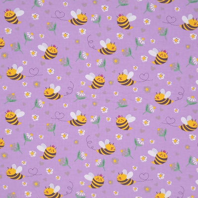 Smiling bees, flowers and hearts printed on a lilac cotton jersey fabric
