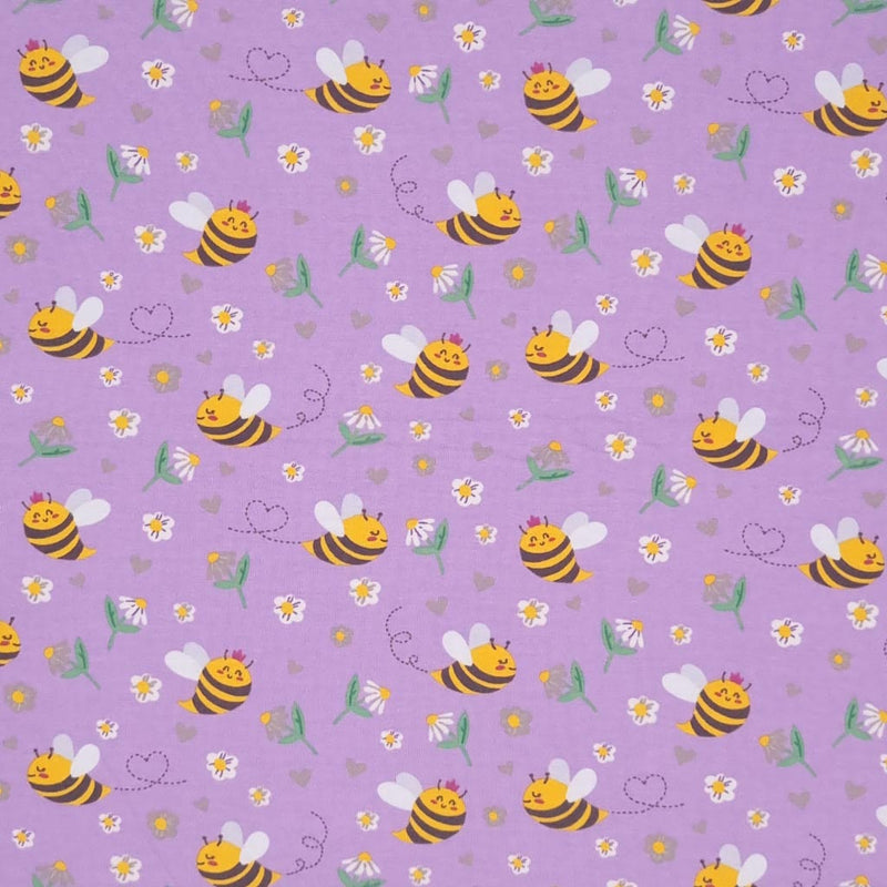 Smiling bees, flowers and hearts printed on a lilac cotton jersey fabric