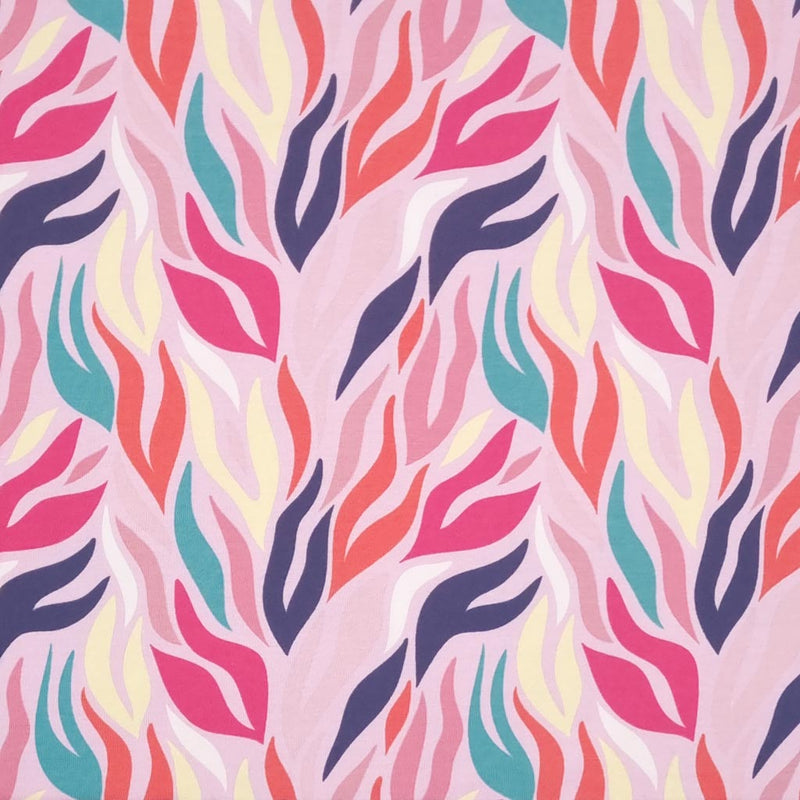 A colourful zebra design printed on a pink cotton jersey fabric