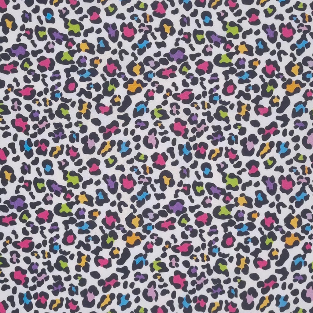A funky leopard print with pinks, oranges, blues and greens digitally printed on a quality white 100% cotton fabric.