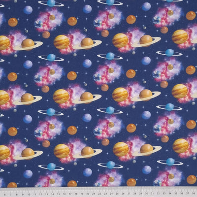 Brightly coloured planets, stars and clouds are digitally printed on a quality navy 100% cotton fabric with a cm ruler at the bottom