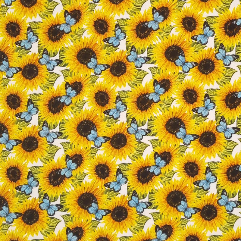Beautiful bright sunflowers with vibrant blue butterflies are digitally printed on a quality white 100% cotton fabric.