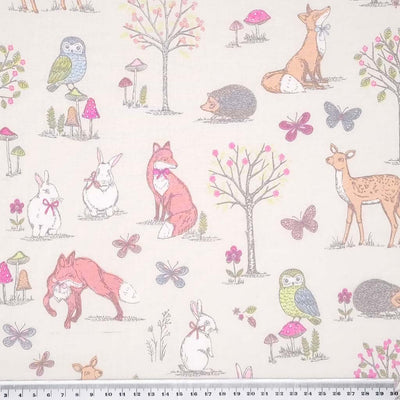 An endearing woodlland scene featuring owls, rabbits, foxes and hedgehogs, all printed on a cream, 100% cotton fabric with a cm ruler