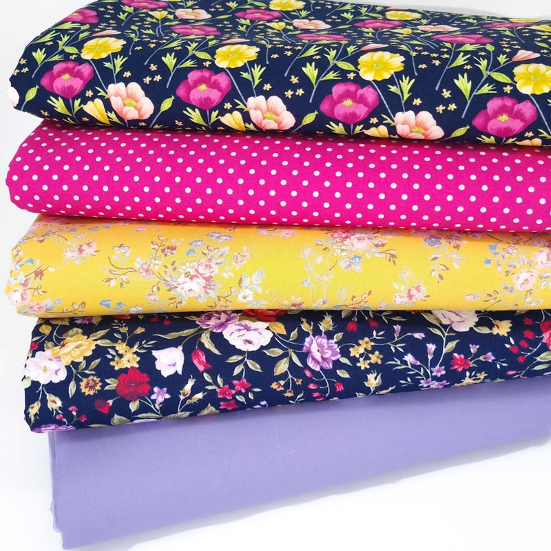 A cotton fat quarter bundle of 5 floral fabrics in lilac, navy and cerise