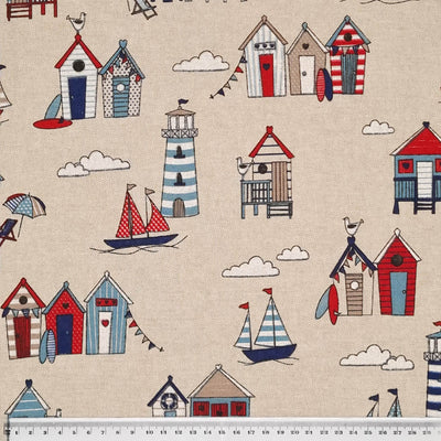 Nautical coloured beach huts are printed on a craft canvas fabric with a cm ruler