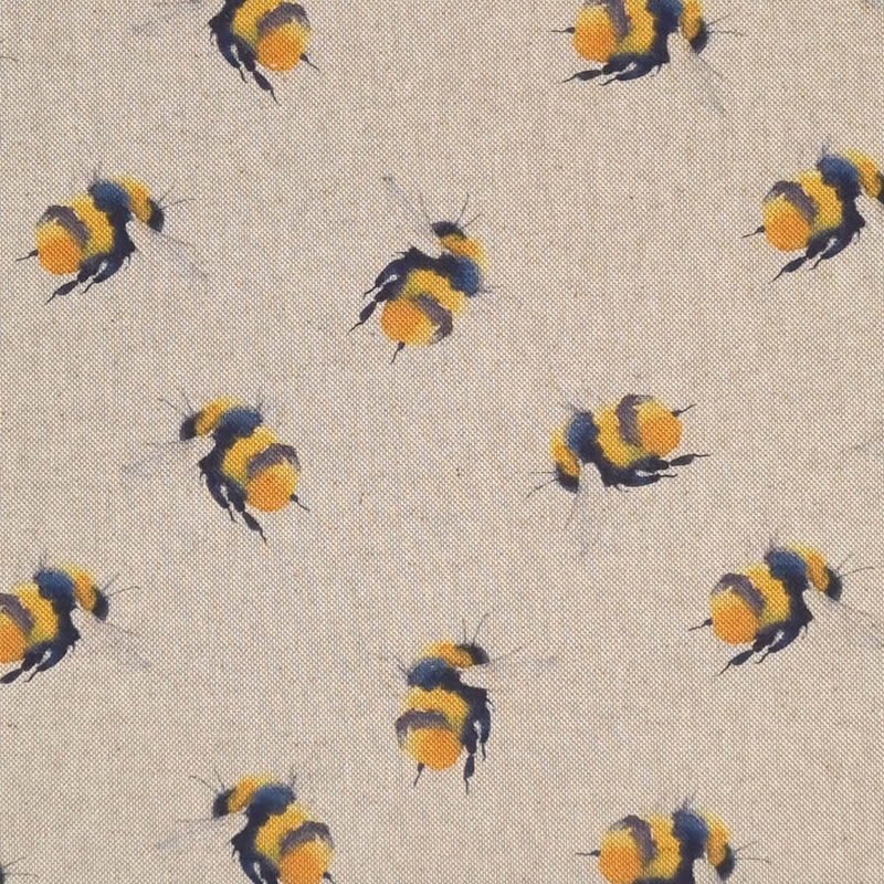 Large bumblebees are printed on a craft canvas fabric