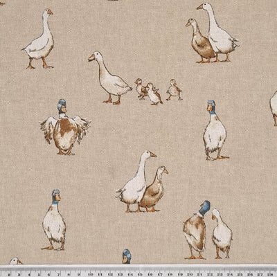 Shabby ducks are printed on a craft canvas fabric with a cm ruler