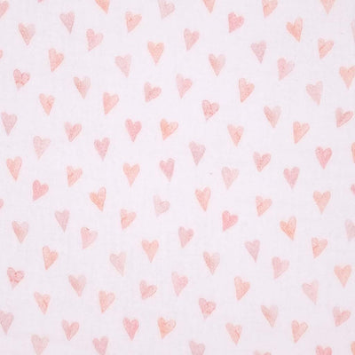 Small rose coloured hearts printed on an organic, white double gauze fabric.