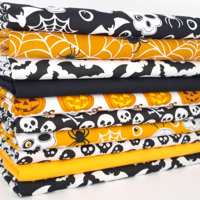 A bundle of ten halloween polycotton fat quarters in black and orange coloursways