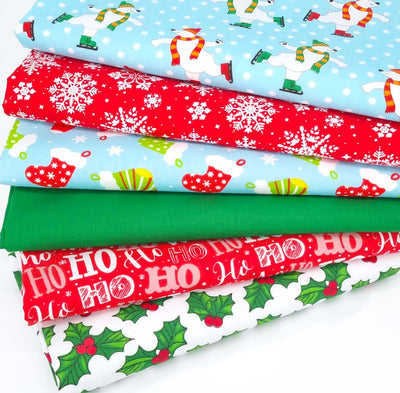 A christmas fat quarter bundle of 6 festive designs with skating polar bears, snowflakes, stockings and holly.