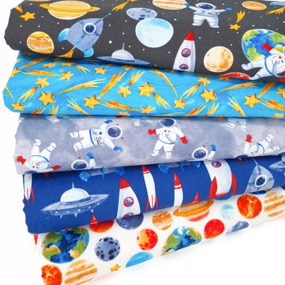 A colourful fat quarter bundle of cotton fabric prints with astronauts, shooting starts, planets and moons