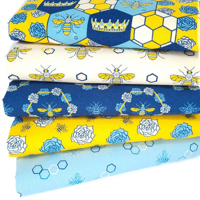 A cotton fat quarter bundle of 5 blue and cream designs featuring bees and flowers