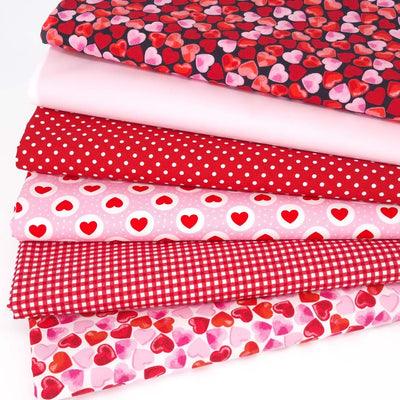 A valentine fat quarter bundle featuring hearts and checks in red and pink by Rose & Hubble
