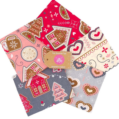 A festive fat quarter bundle of cotton fabrics with gingerbread, hearts and hot chocolate