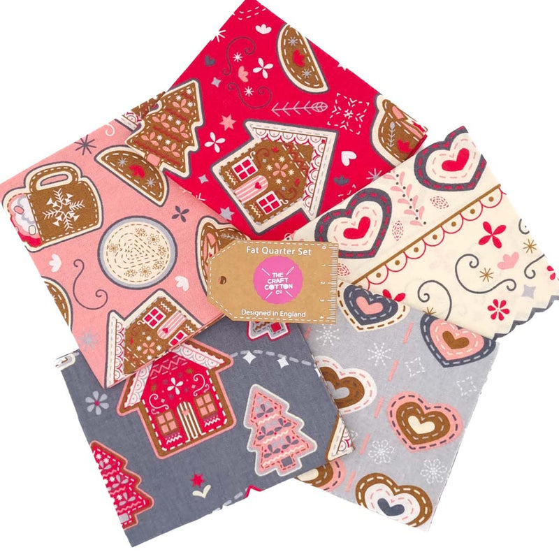 A festive fat quarter bundle of cotton fabrics with gingerbread, hearts and hot chocolate