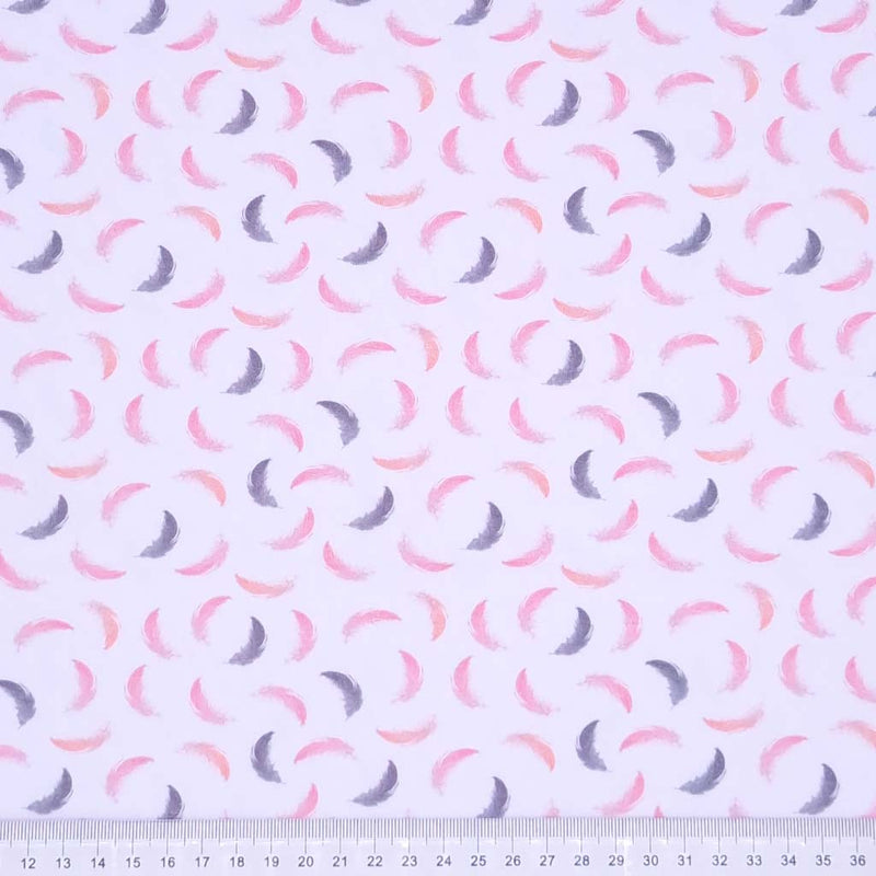 Pink and grey feathers printed on a white cotton jersey fabric with a cm ruler at the bottom