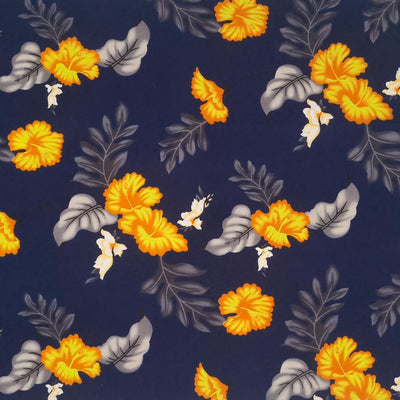 Vibrant orange flowers are printed on a navy coloured cotton poplin.