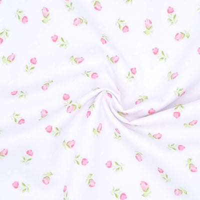 A delicate pink baby rose is printed on a white polycotton fabric