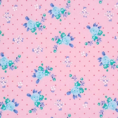 A beautiful mint, vintage blooming rose polycotton fabric on a pink background