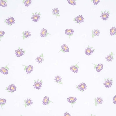 Lilac delicate daisies printed on a white polycotton fabric