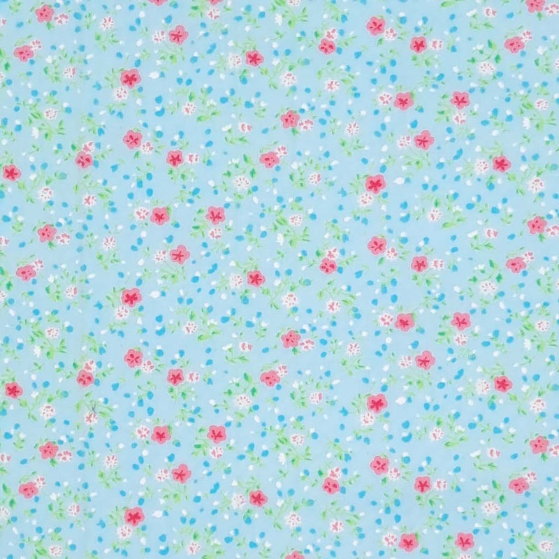 A delicate ditsy floral polycotton in turquoise
