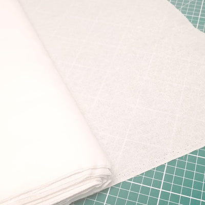 A bolt of white fusible cotton interfacing