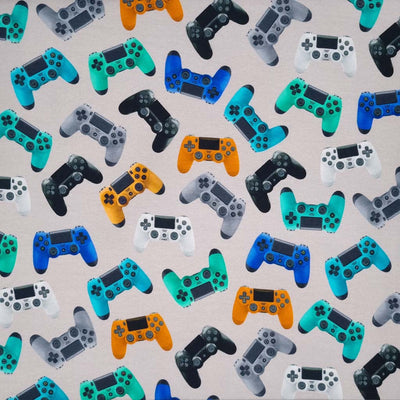Multi coloured game controllers printed on a light grey soft sweat jersey fabric