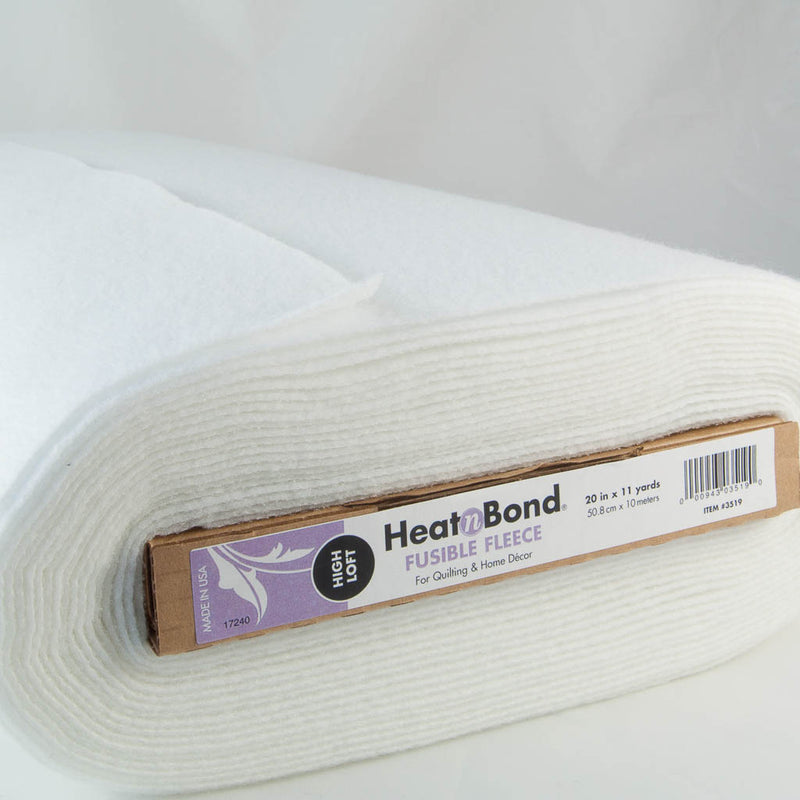 A bolt of heat n bond fusible fleece showing the product details on the bolt end
