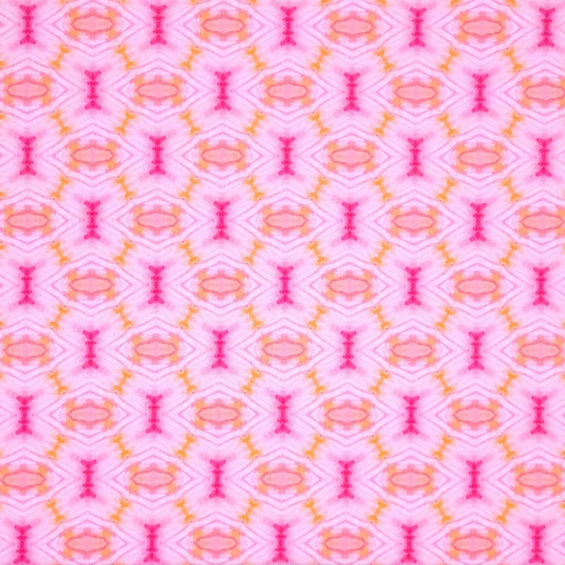 A diamond geometric batik print in pink and orange on a 100% cotton fabric