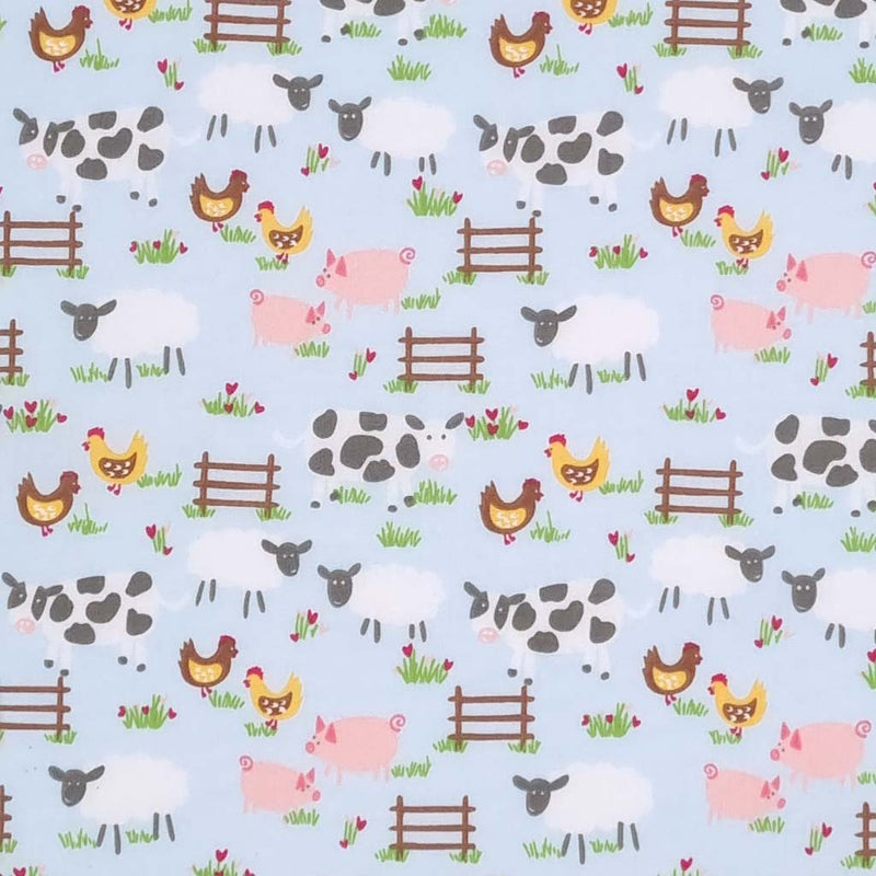 Chickens, pigs, sheep and cows are printed on a blue polycotton fabric