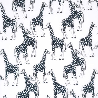 Black and white giraffes are printed on a white polycotton fabric