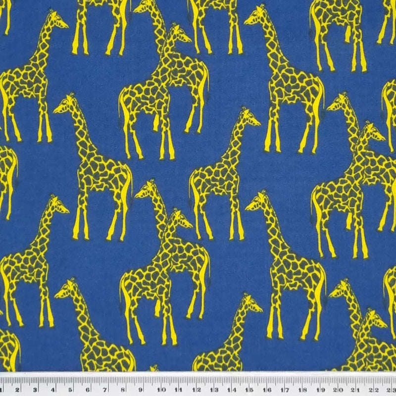 A giraffe fabric print in yellow and blue with a cm ruler