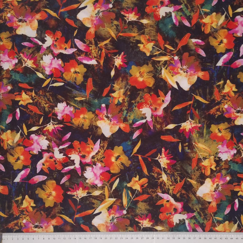 Orange and red leaves printed on a viscose radiance fabric with a cm ruler at the bottom
