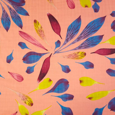 Blue and red falling petal design printed on a pink linen look viscose fabric