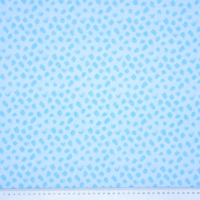 Blue paint dabs are printed on a sky blue 100% cotton fabric with a cm ruler at the bottom