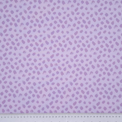 Lilac paint dabs are printed on a lilac, 100% cotton fabric with a cm ruler at the bottom