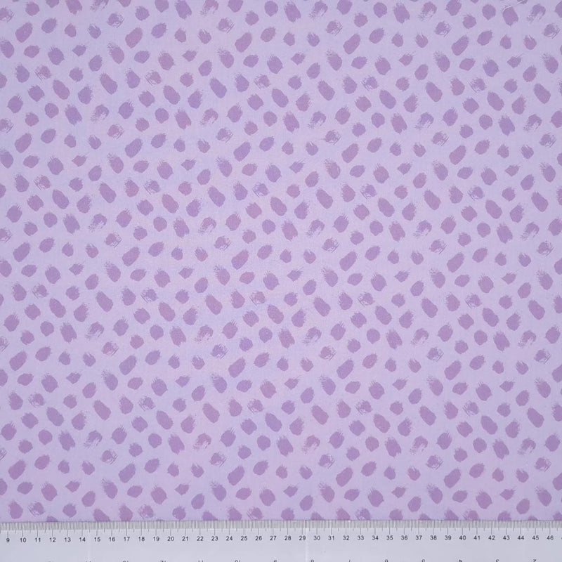 Lilac paint dabs are printed on a lilac, 100% cotton fabric with a cm ruler at the bottom
