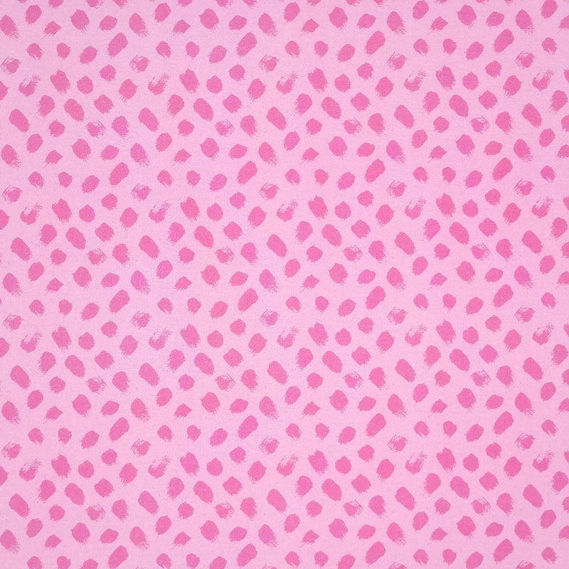 Pink paint dabs are printed on a pink, 100% cotton fabric