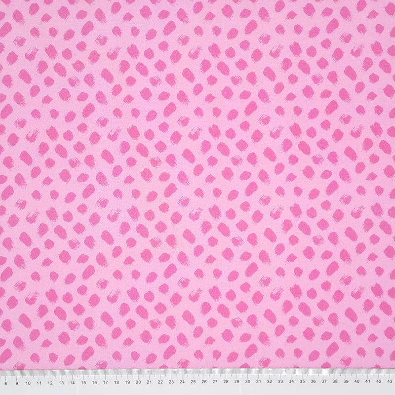 Pink paint dabs are printed on a pink, 100% cotton fabric with a cm ruler at the bottom
