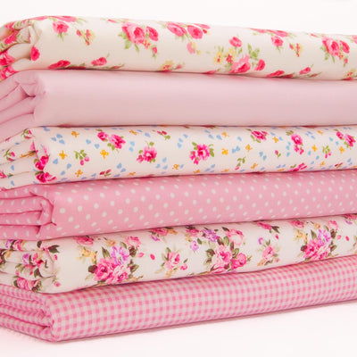 A 6 piece fat quarter bundle of pink Rose & Hubble floral fabrics