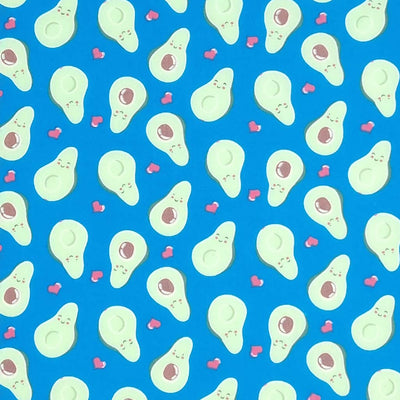 Smiling avocados are printed on a quality blue polycotton fabric