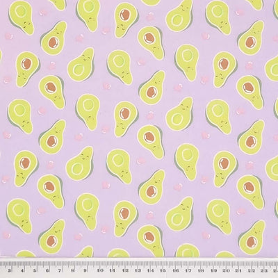 Smiling avocados are printed on a quality lilac polycotton fabric with a cm ruler