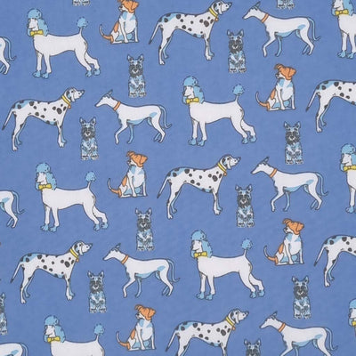 Poodles, dalmatians and terriers appear on this pet lovers polycotton fabric print on blue