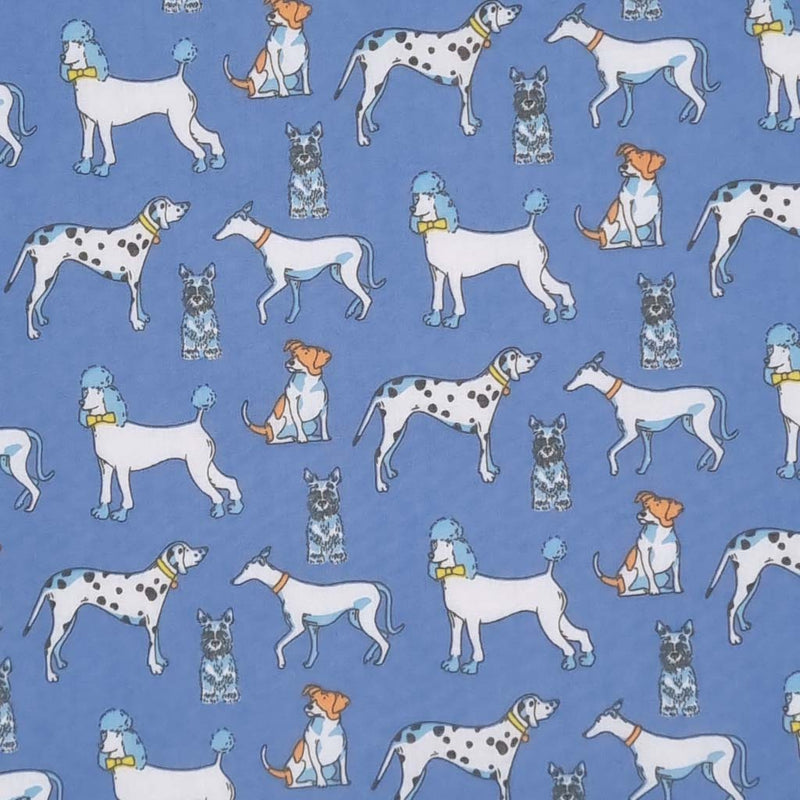 Poodles, dalmatians and terriers appear on this pet lovers polycotton fabric print on blue